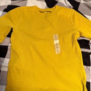 This gold old navy shirt has never been used.